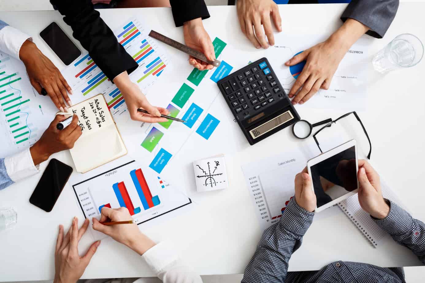 businessmen-hands-white-table-with-documents-drafts