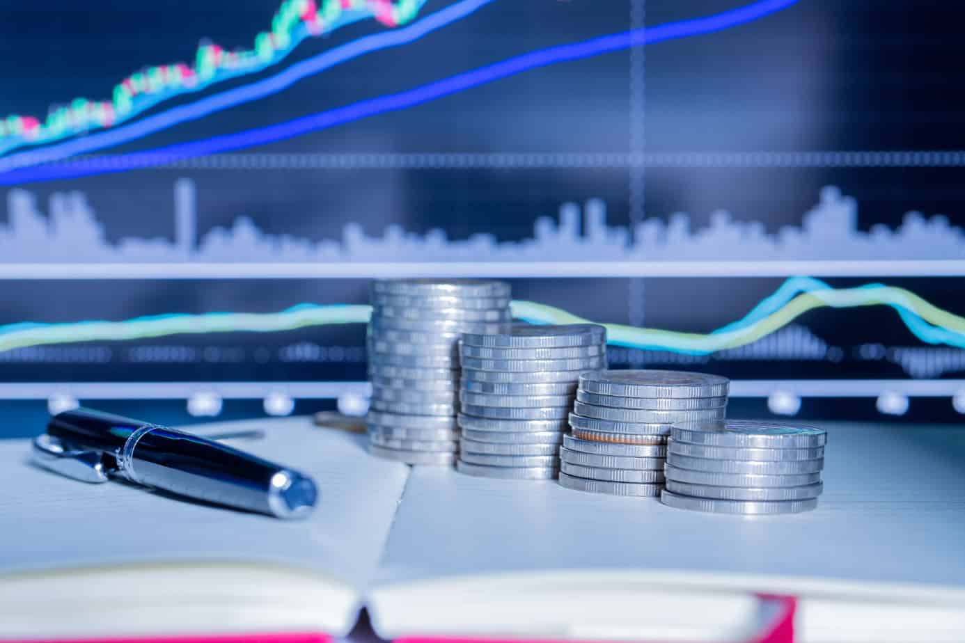 stack-money-coin-with-trading-graph