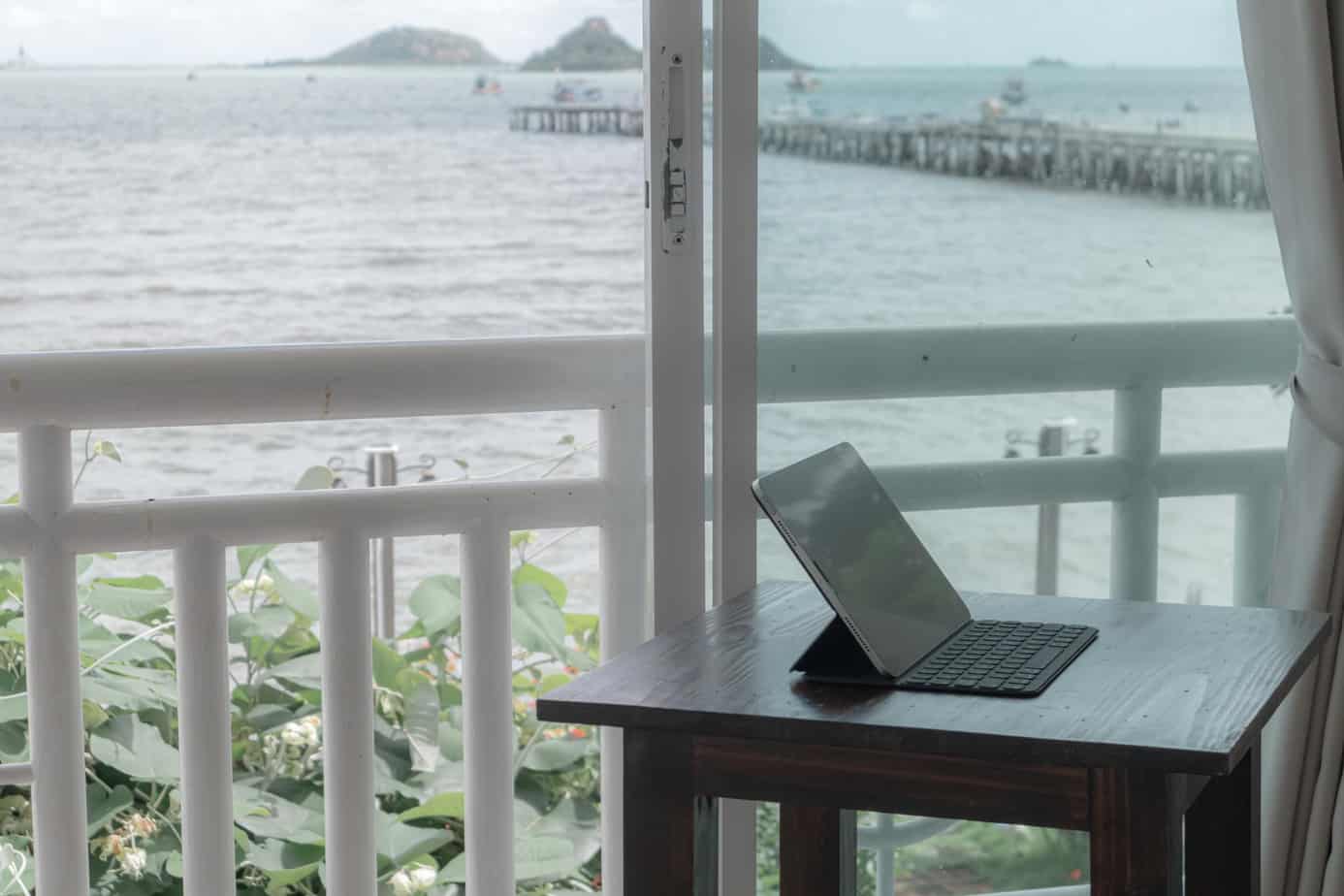 tablet-table-balcony-hotel-room-with-sea-view
